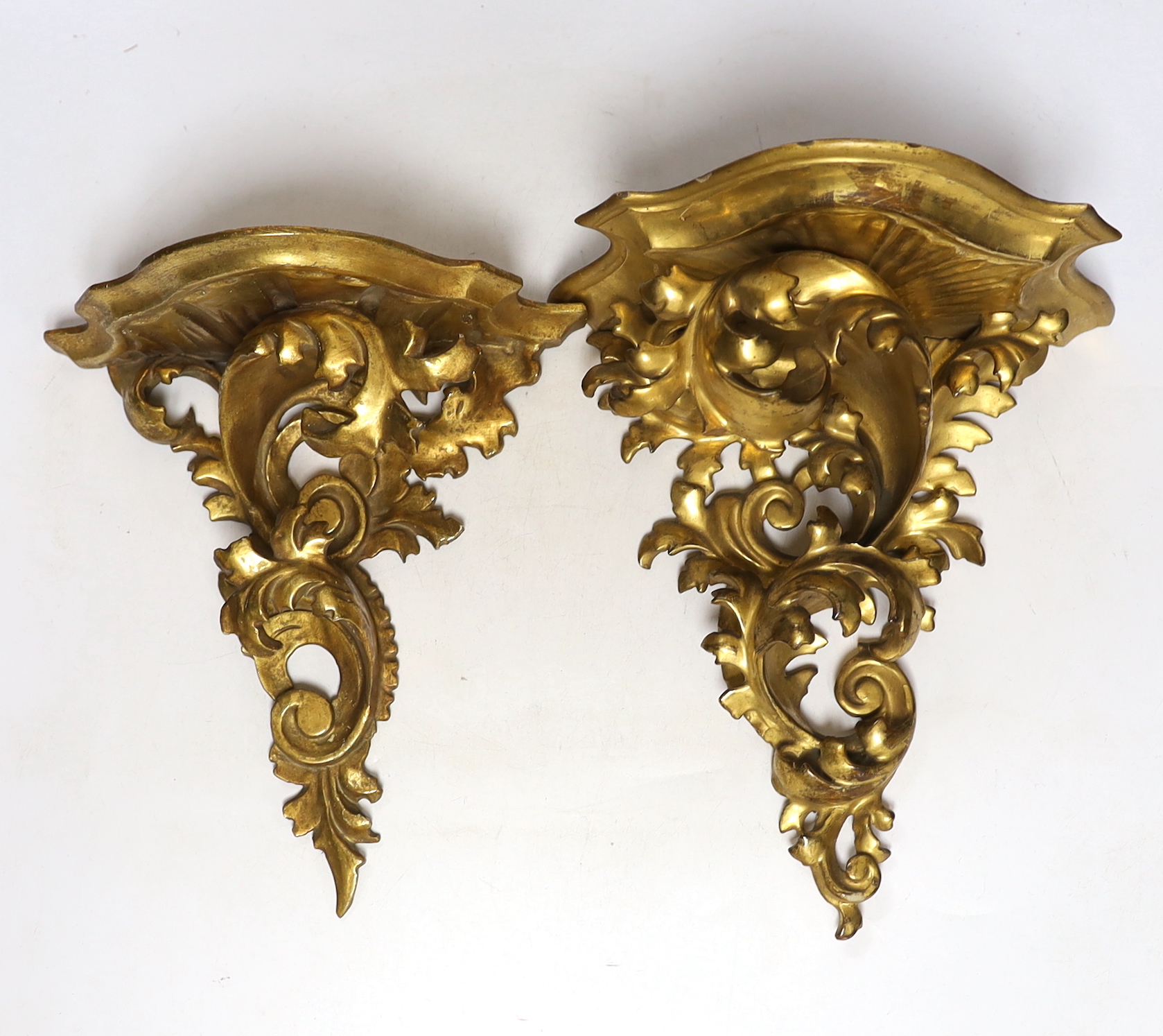 Two late 19th century Florentine rococo style giltwood wall brackets, largest 27cm long